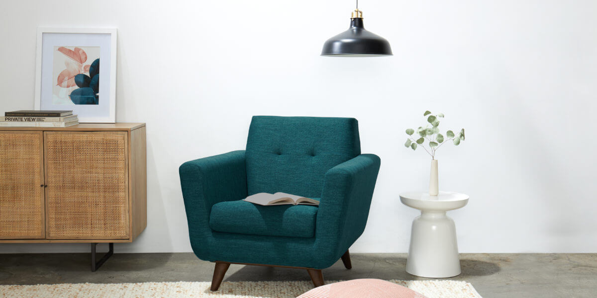 A stylish Aura lounge chair in a reading nook.